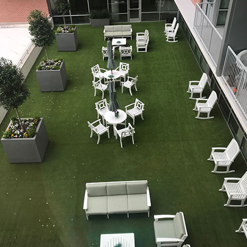 SynLawn Rooftop aerial view artificial turf with white chairs