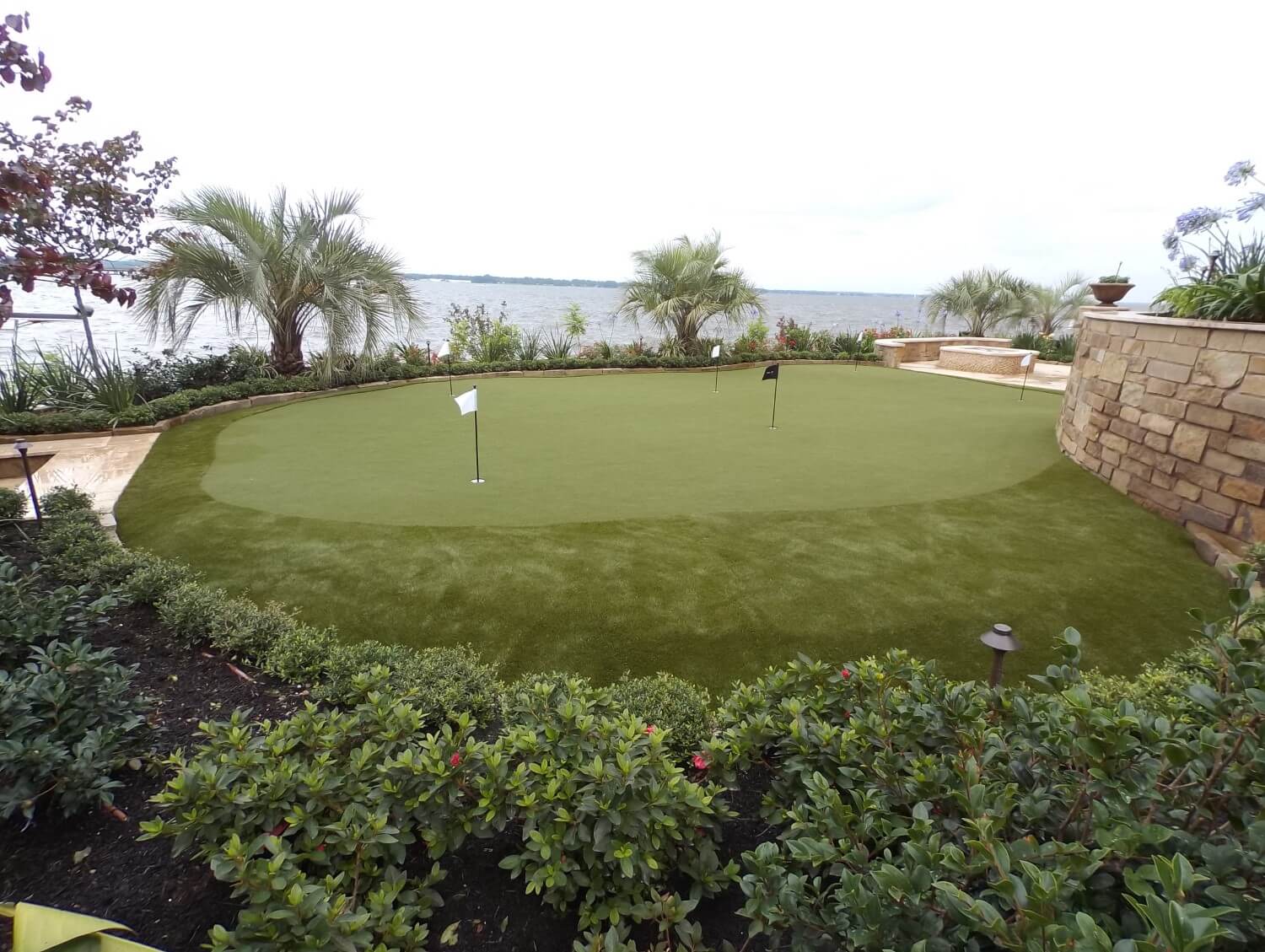 Waterfront artificial grass golf green installed by SYNLawn
