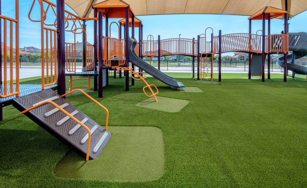 Jungle gym installed in Frisco Independent School District on SYNLawn Houston artificial grass