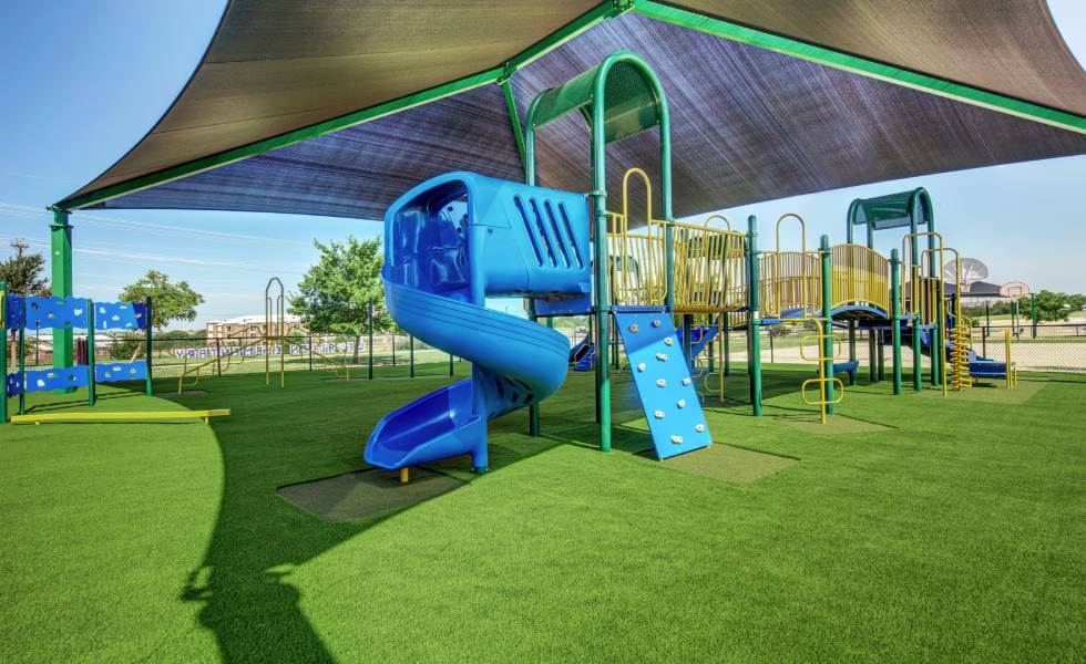 frisd-isd-body-images-4 Blue Jungle Gym installed on SYNLawn playground turf for frisco independent school district