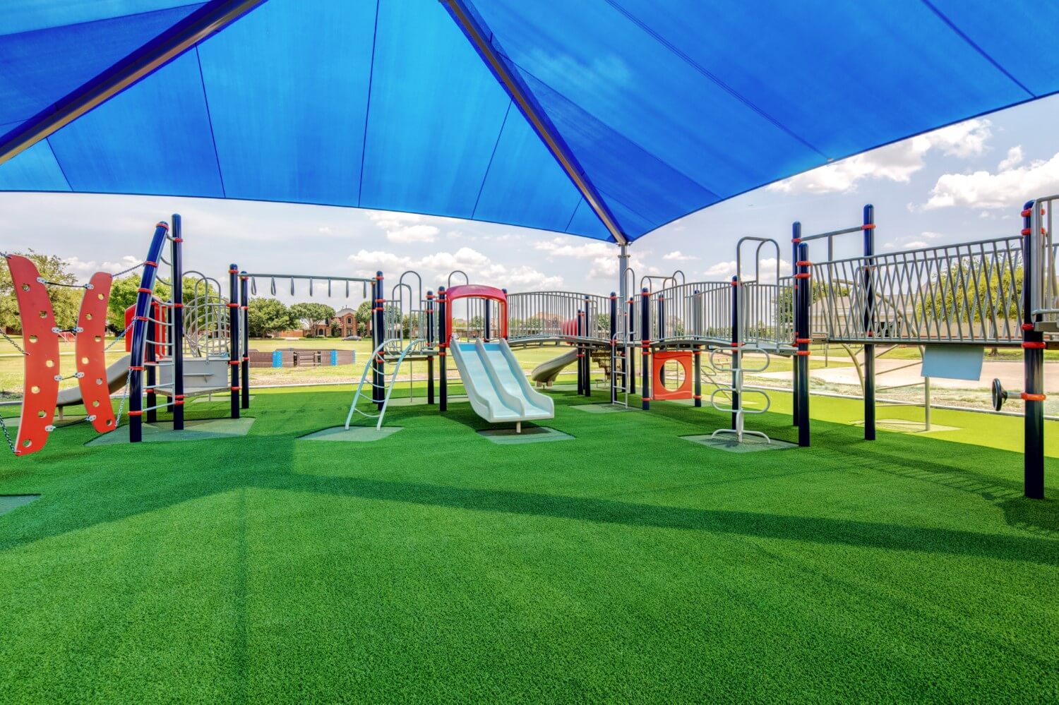 jungle gym installed on artificial grass